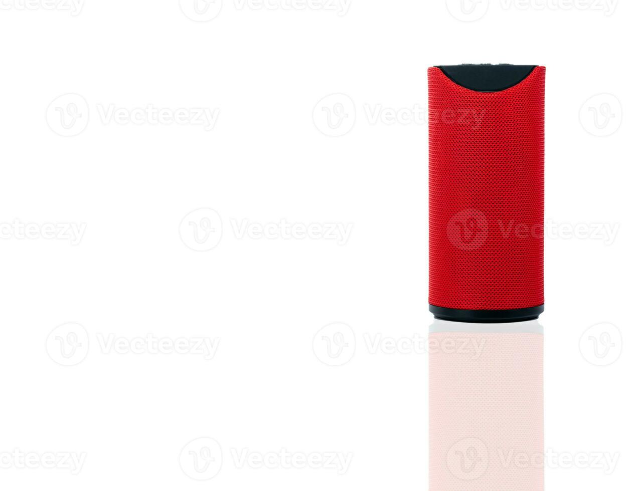 Wireless portable speaker isolated on white background. Red Digital portable speakers. Small sound music box speaker. Modern design mini portable Wireless loudspeaker. Digital wireless technology. photo