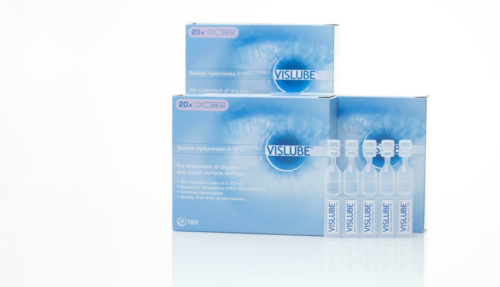 CHONBURI, THAILAND-MAY 3, 2023 Vislube artificial tears. Lubricating eye drops in plastic tube and blue package. Sodium hyaluronate eye drops for treatment dry eye. Artificial tears vial. Eye care. photo