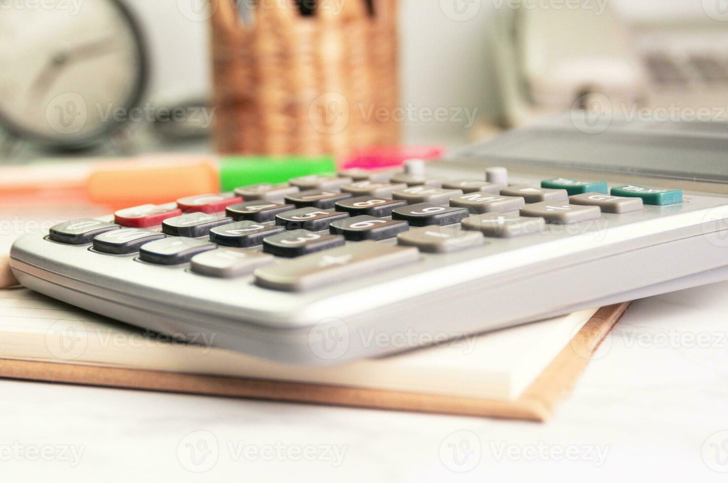 close up the button of calculator at office concept equipment Calculation of income, expenditure, calculation photo