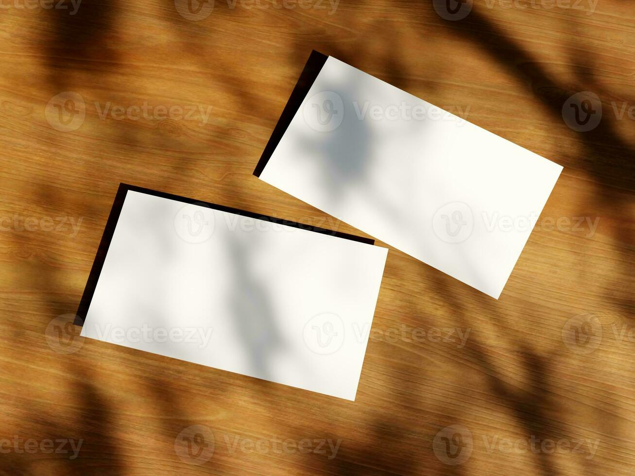 Clean minimal business card mockup with the leaves shadow on wood table background photo