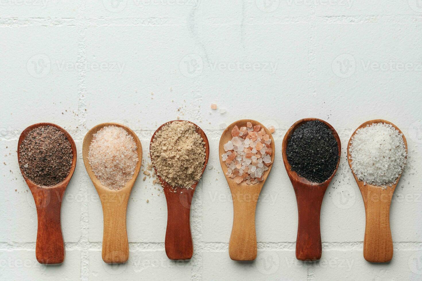 Spoons  with assorted speciality salt photo