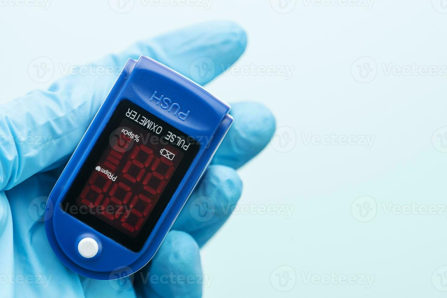 Pulse oximeter in doctor hand photo