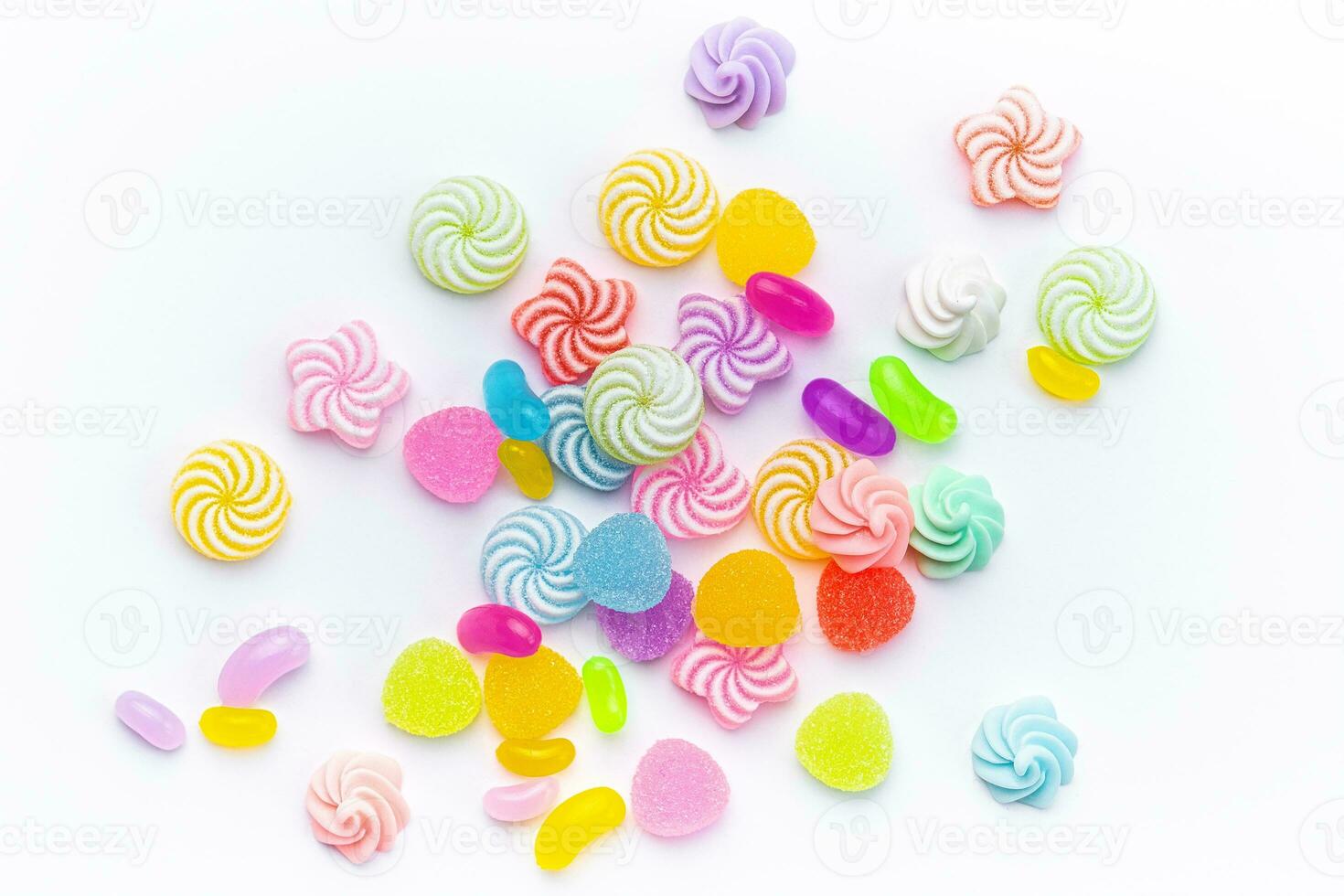 Sweet lollipops and candies on white background photo