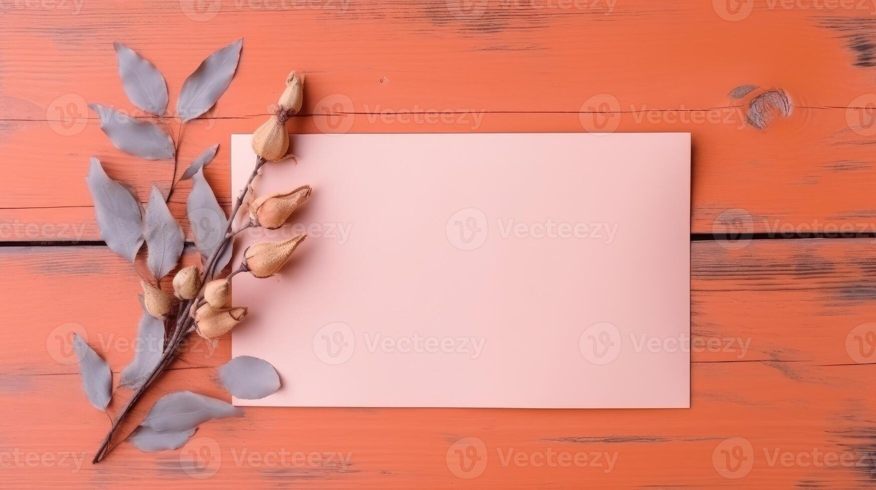 Pink Blank Paper Card Mockup, Dried Leaves and Seed Pods Branch on Orange Wooden Texture Table Top. . photo