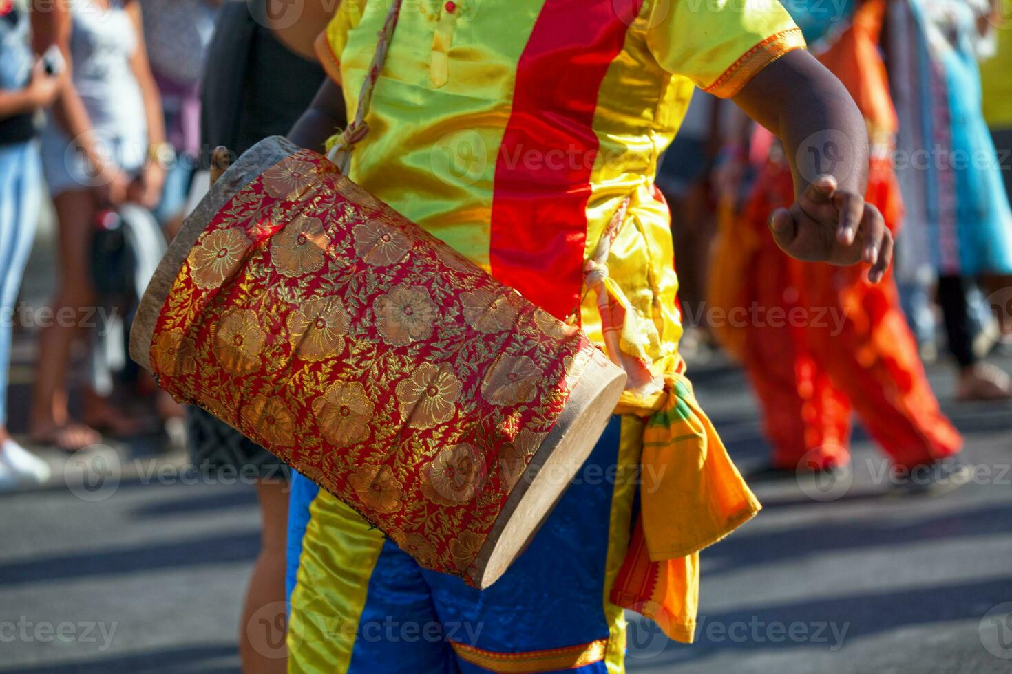 Percussionist playing with a dhol during the carnival of Grand Boucan photo