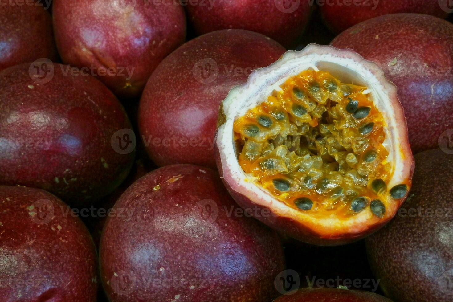 Stack of passion fruits on a market stall photo