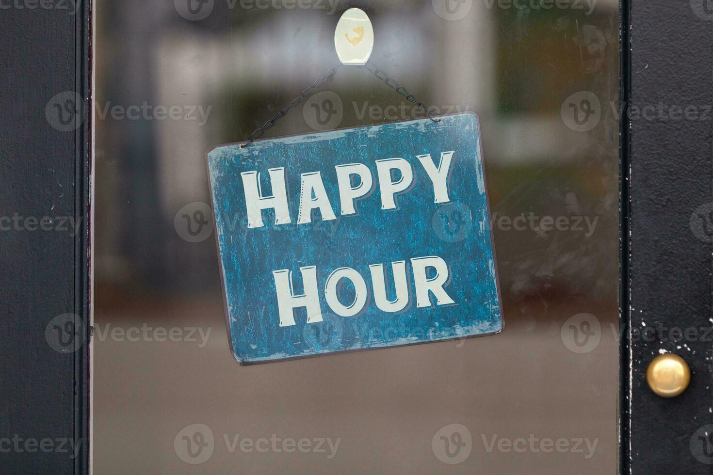 Happy Hour sign in a window photo
