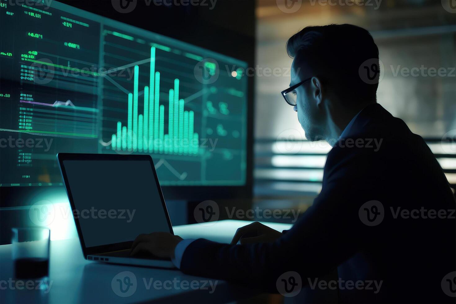 Side View of Handsome Businessman Using Laptop and Sitting at Desk with Green Financial Dashboard In Dark Room. Illustration. photo