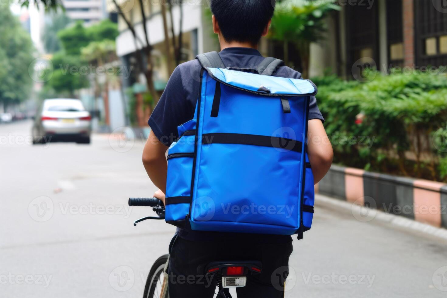 Back View of Fictional Food Delivery Man Riding on Vicky Bike with Thermal Bag, Express Delivery Service from Cafe and Restaurant. . photo
