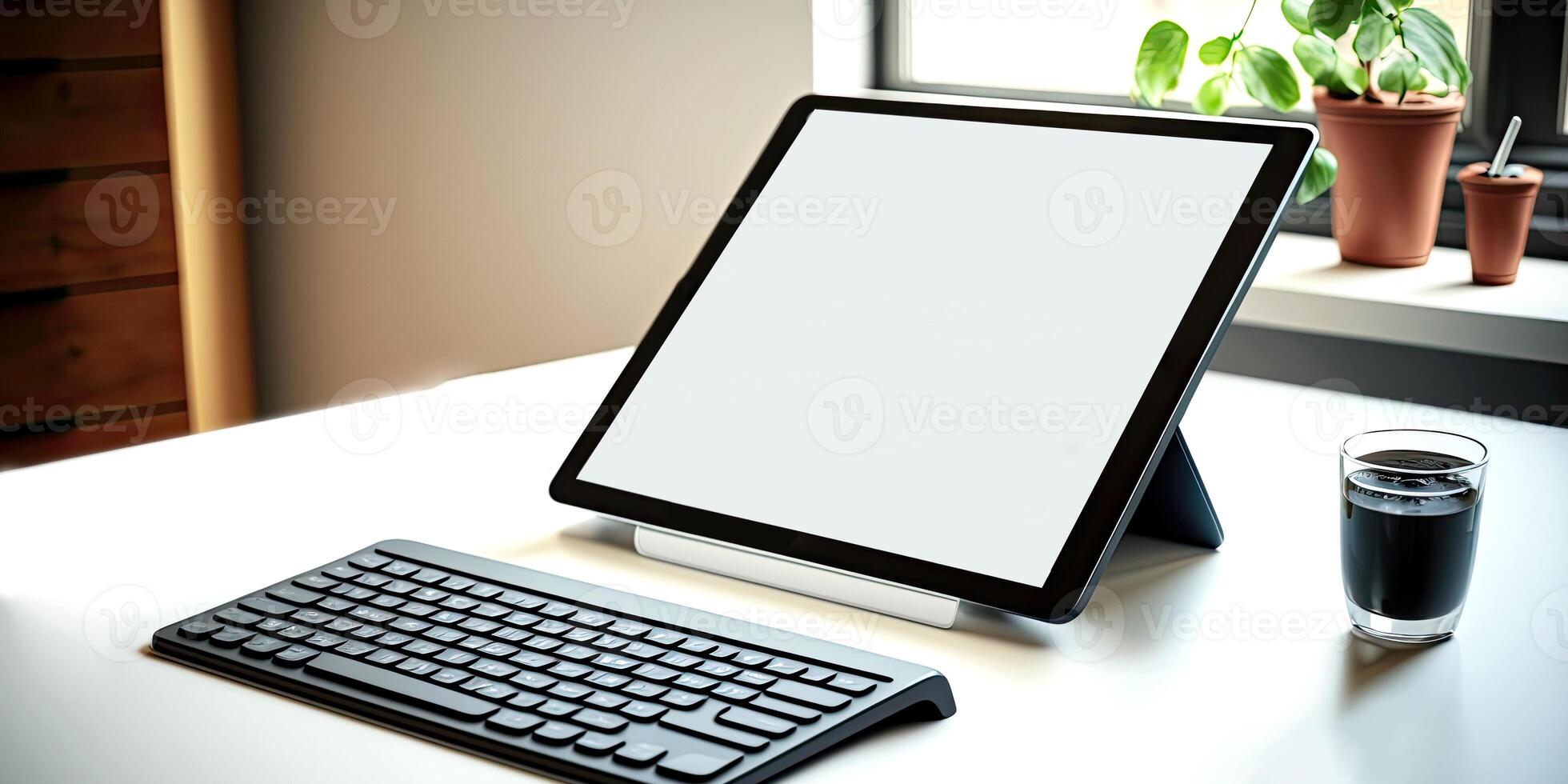 Realistic tablet mock-up for app presentations. The tablet Mockup from above lies slightly slanted on a wooden desk - photo