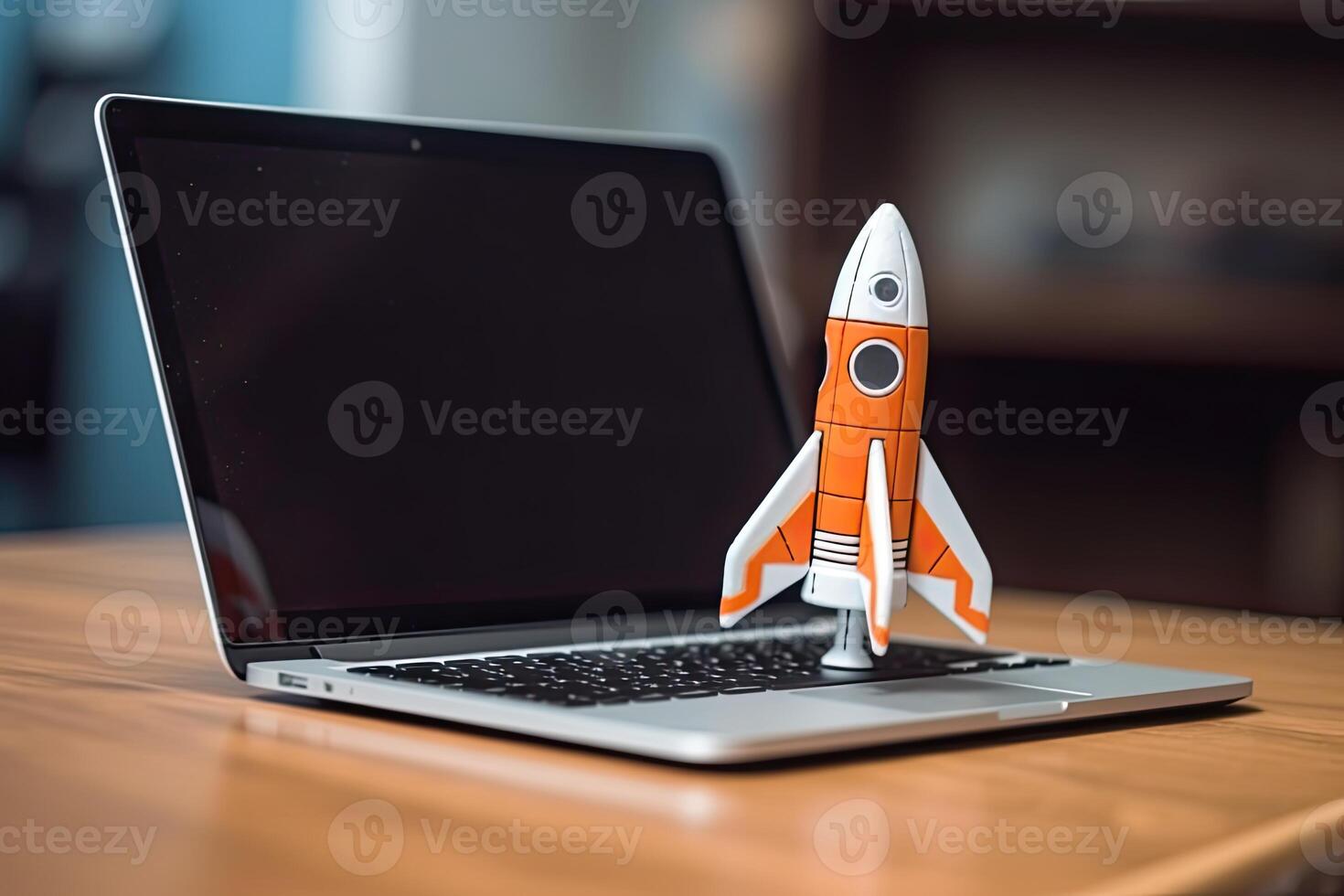 Rocket taking off from laptop screen on top of office desk, successful startup concept, photo