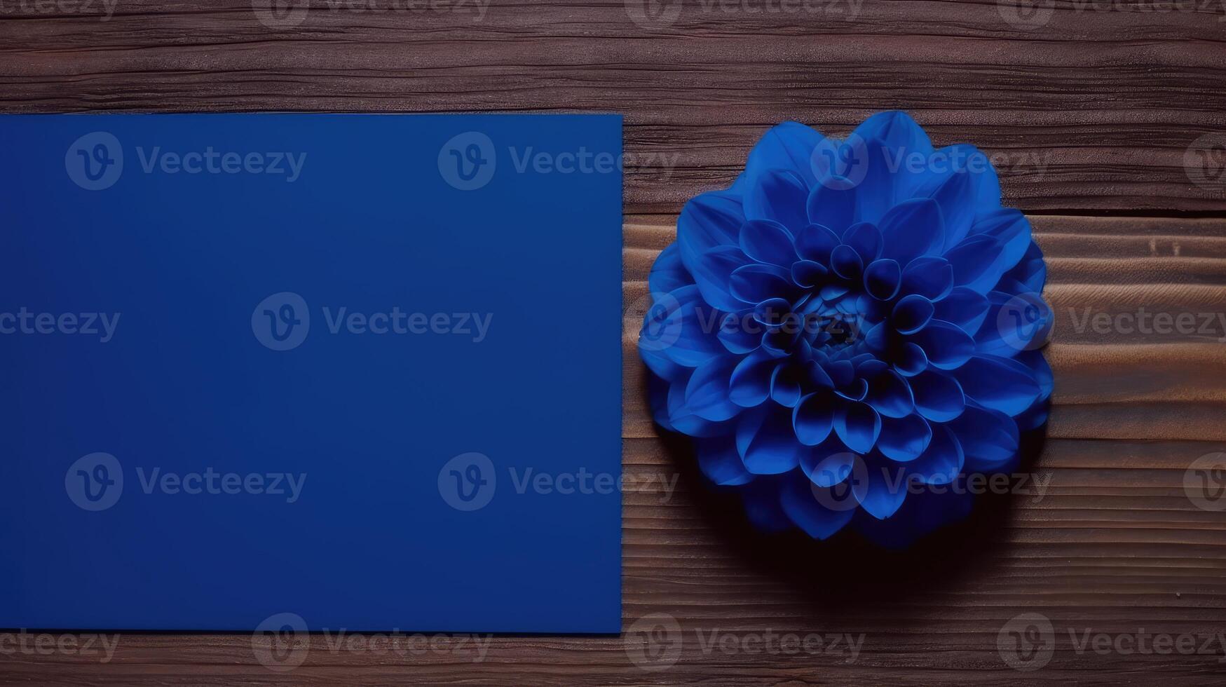 Blank Blue Paper Card Mockup with Dahlia Flower on Wooden Table Top, Generative AI. photo