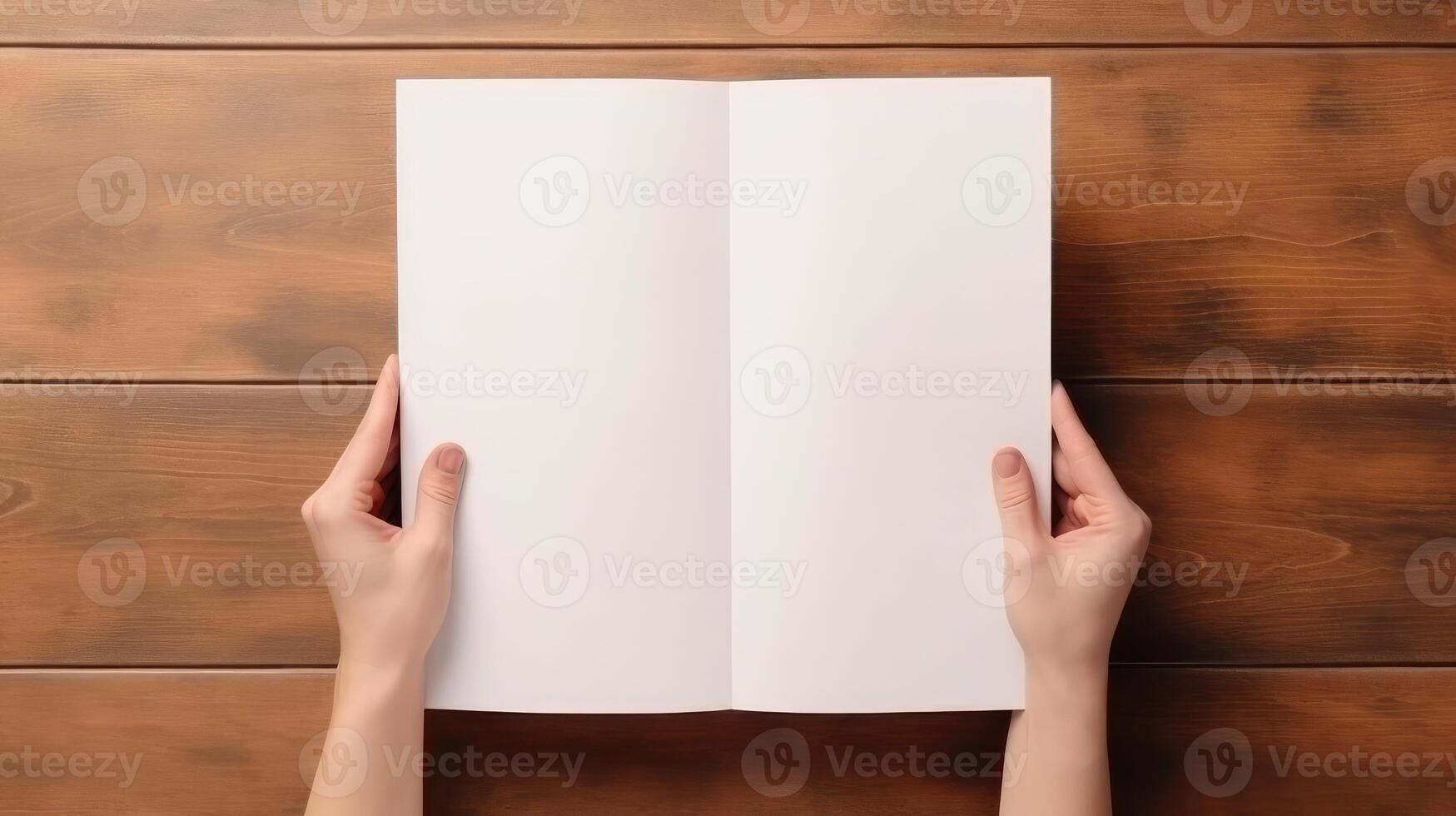 Top View Mockup of Human Hands Holding Blank White Bi-Fold Paper, Flat Lay on Wooden Table. Generative AI Technology. photo