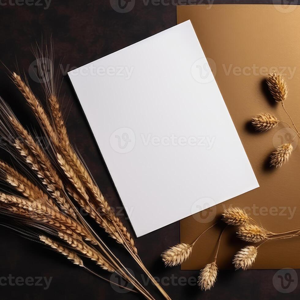 Top View of Blank White Paper with Golden Reeds Branch on Shiny Brown Background for Vintage Delicate Business or Wedding Card Design. . photo