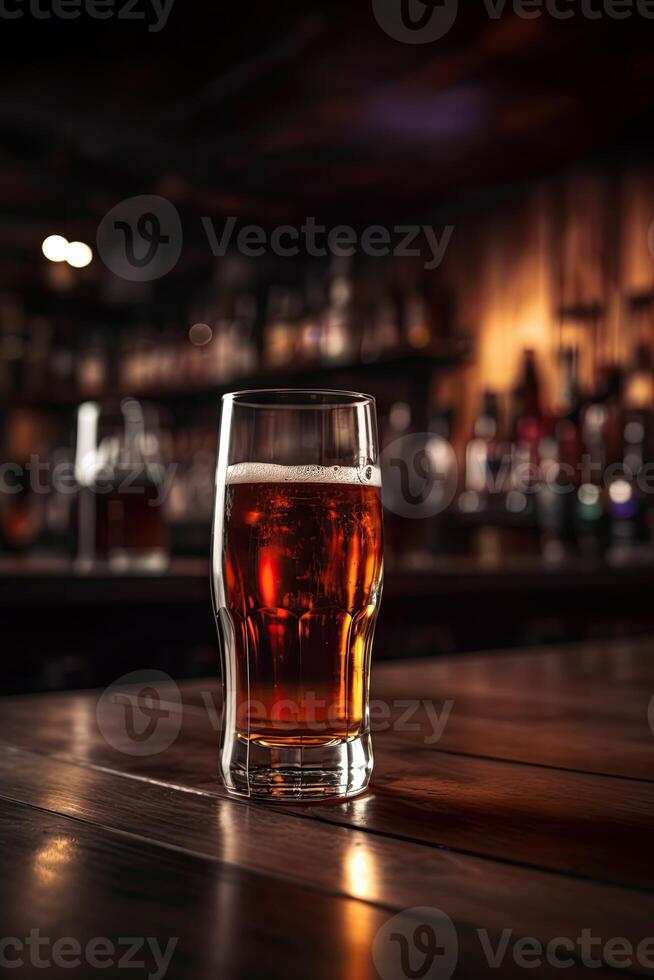 Cold Beer Glass on Wooden Table. Blurred Interior of Pub at the Background. . photo