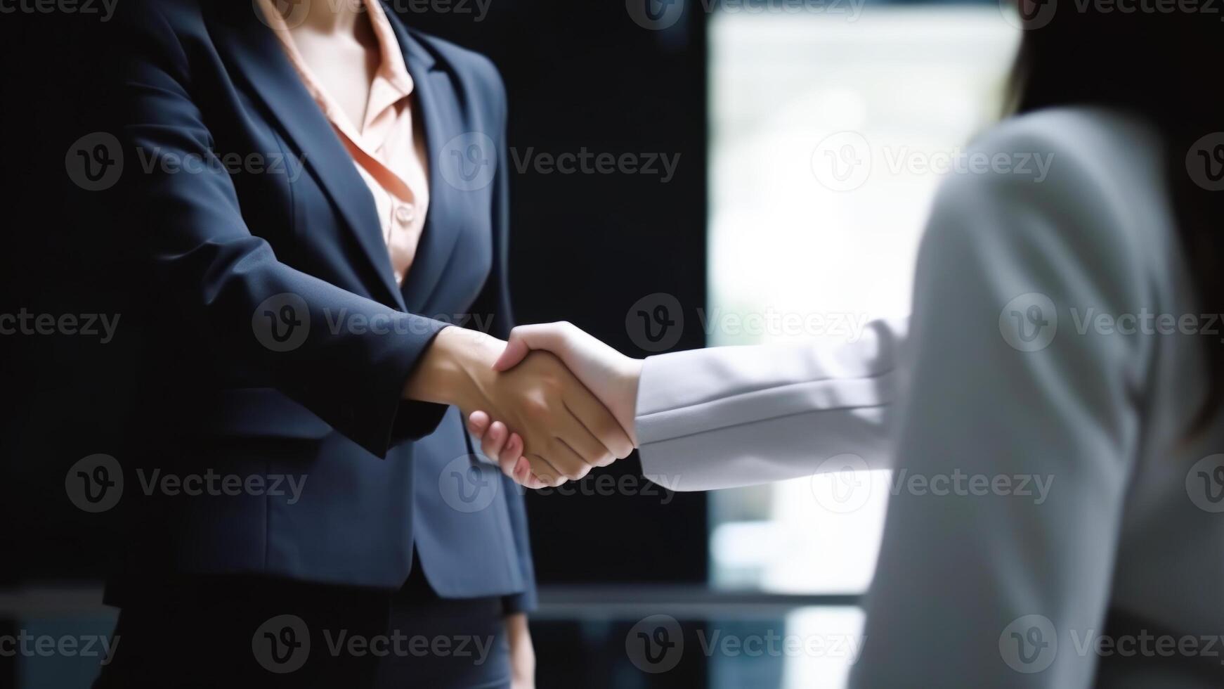 Cropped Image of Business handshake between two women Inside a modern bright office. . photo