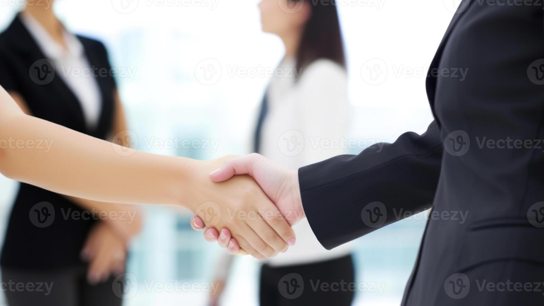 Cropped Image of Business handshake between two women Inside a modern bright office. . photo