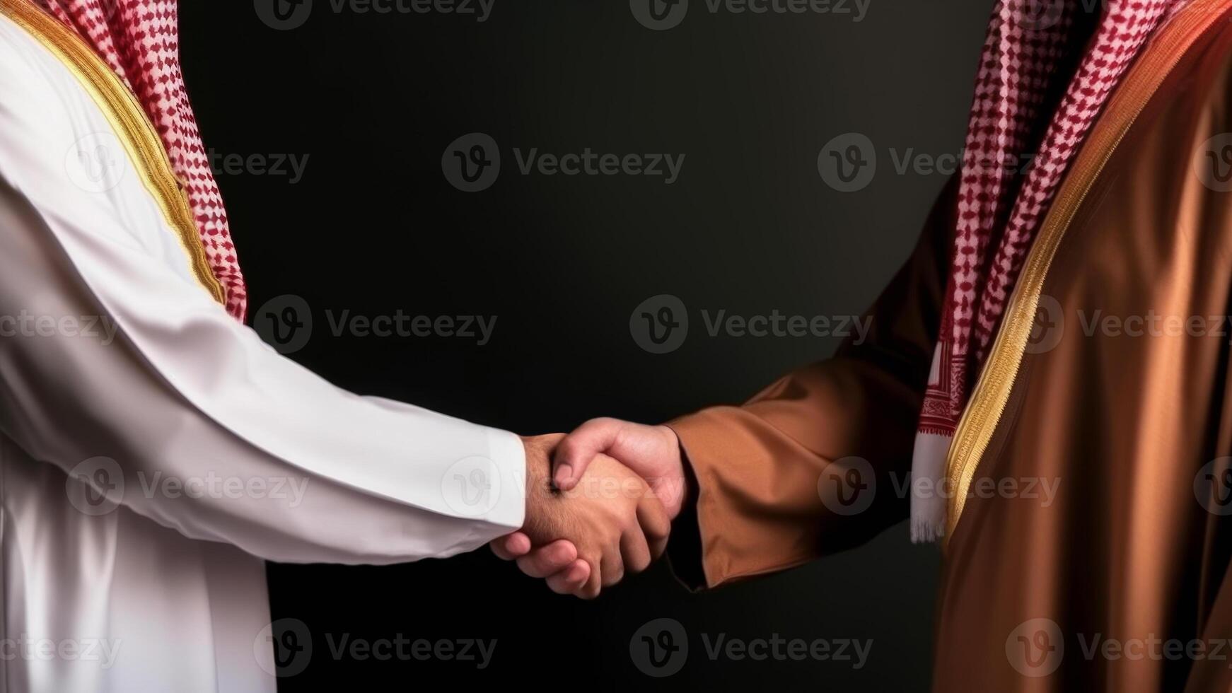 Cropped Image of Business handshake between two Arabian Man on black background. . photo