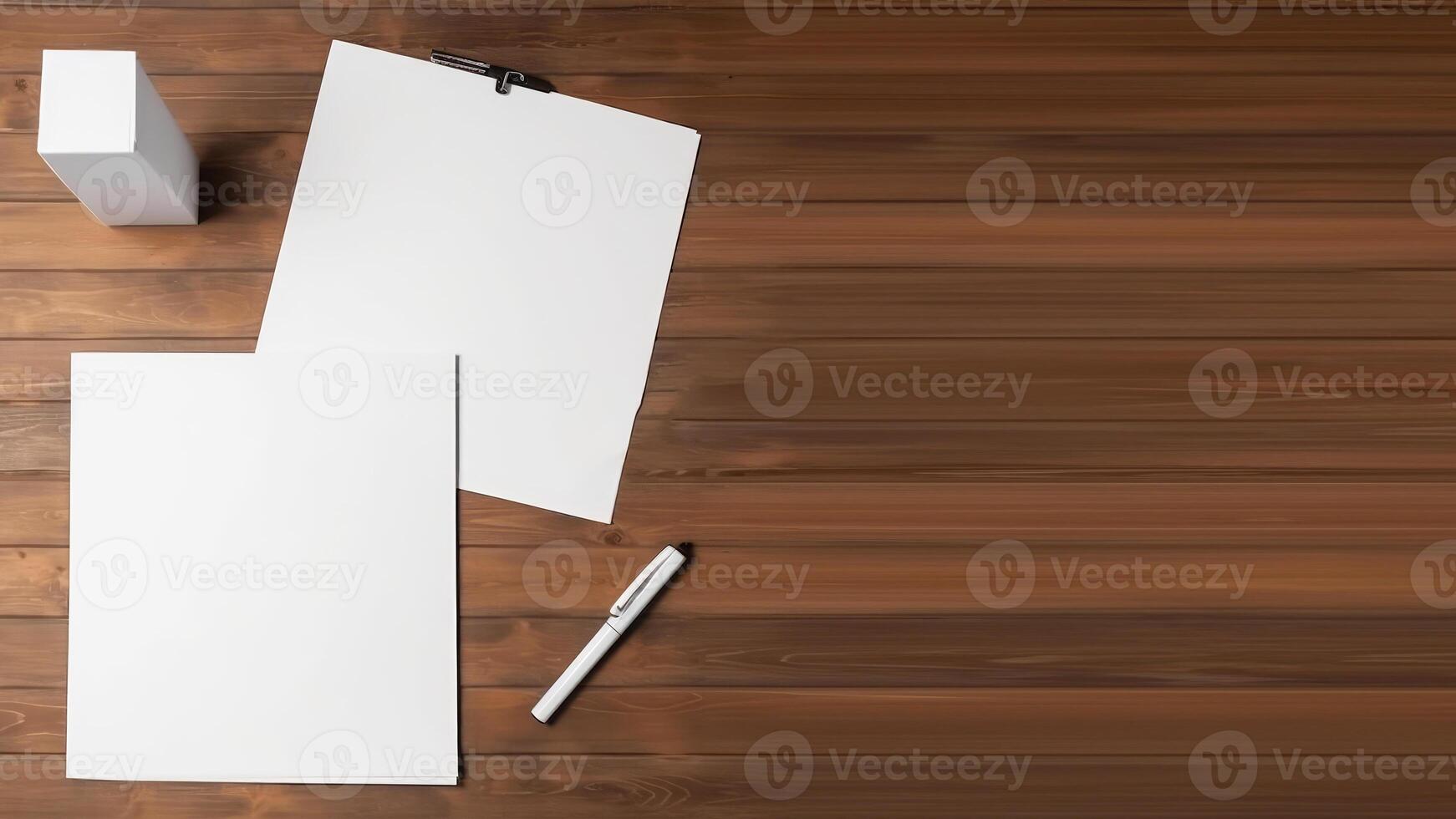 Top View, White Sheet of Blank Paper Mockup with Pen, Box on Wooden Desk. . photo