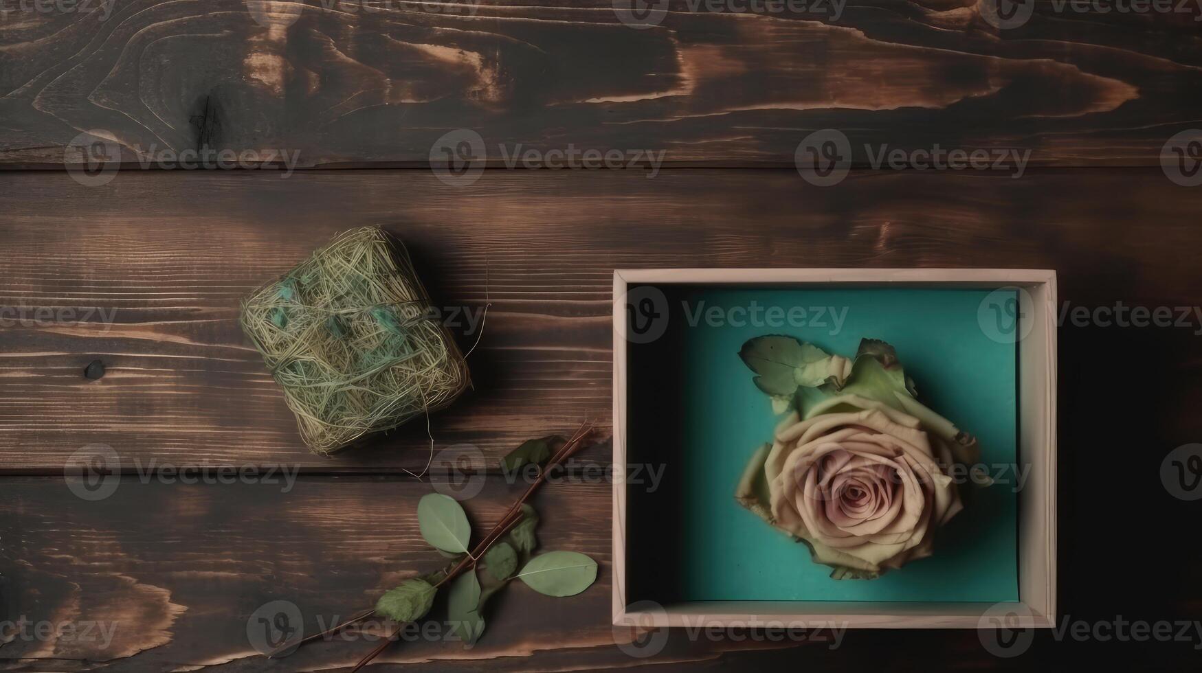 Open Wooden Box of Rustic Rose Flower, Leaves and Square Bale on Plank Texture Table Top. . photo