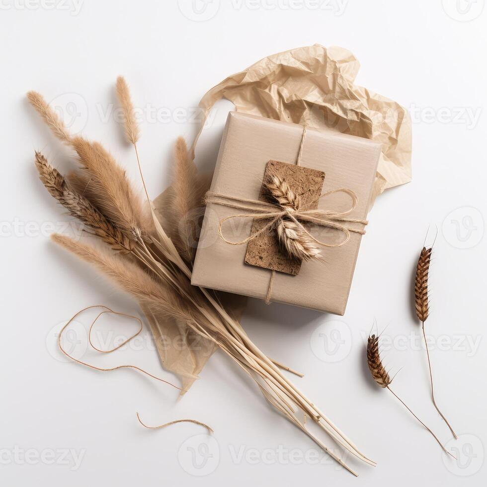Top View of Rustic Style Packed Gift Box with Burlap Thread, Dried Grain Grass and Crumpled Kraft Paper on White Background, . photo