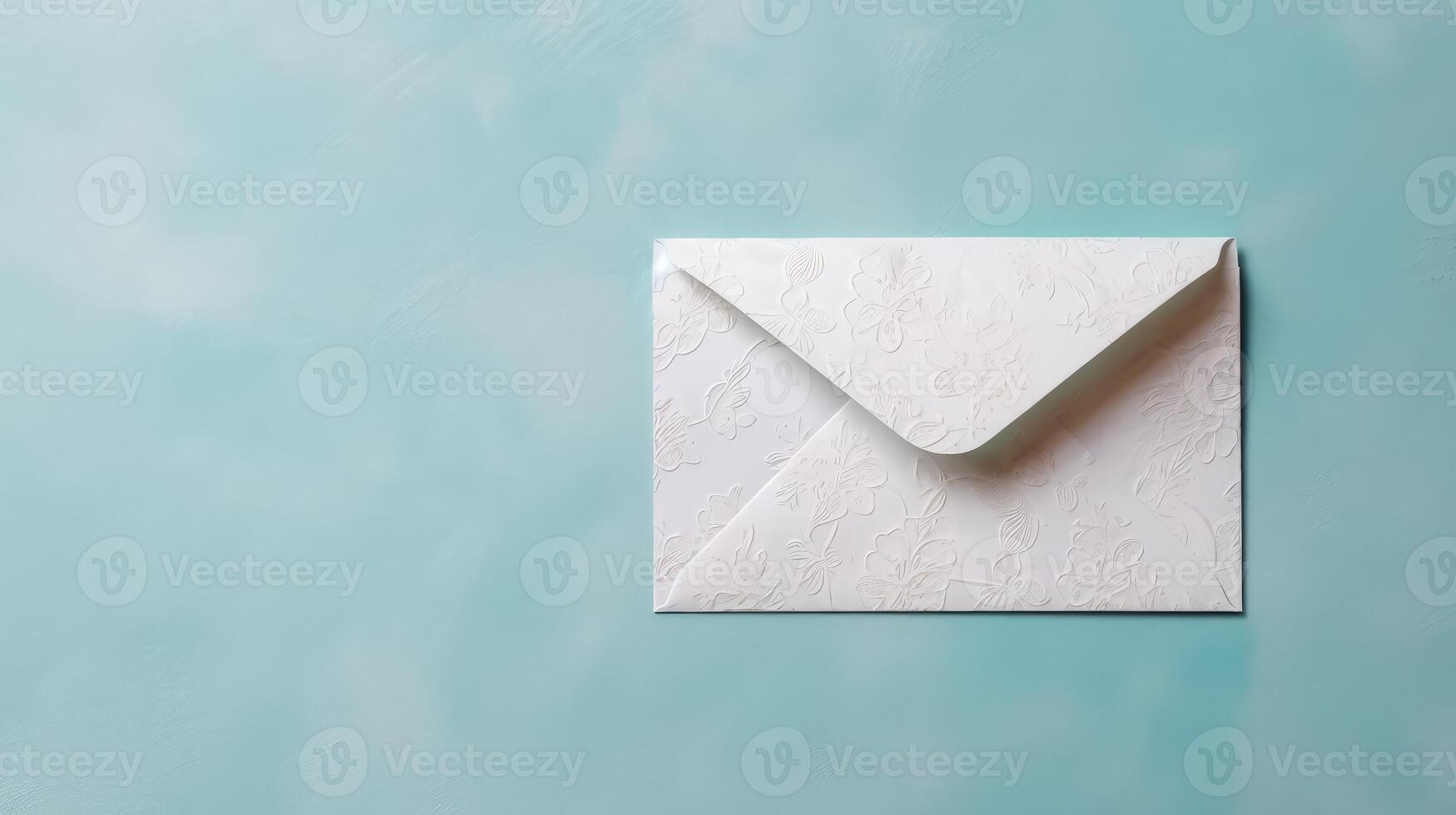 Isolated Silver Customized Floral Embossed Luxury Wedding or Event Card, Envelope on Pastel Blue Texture Background and Space for Message. . photo