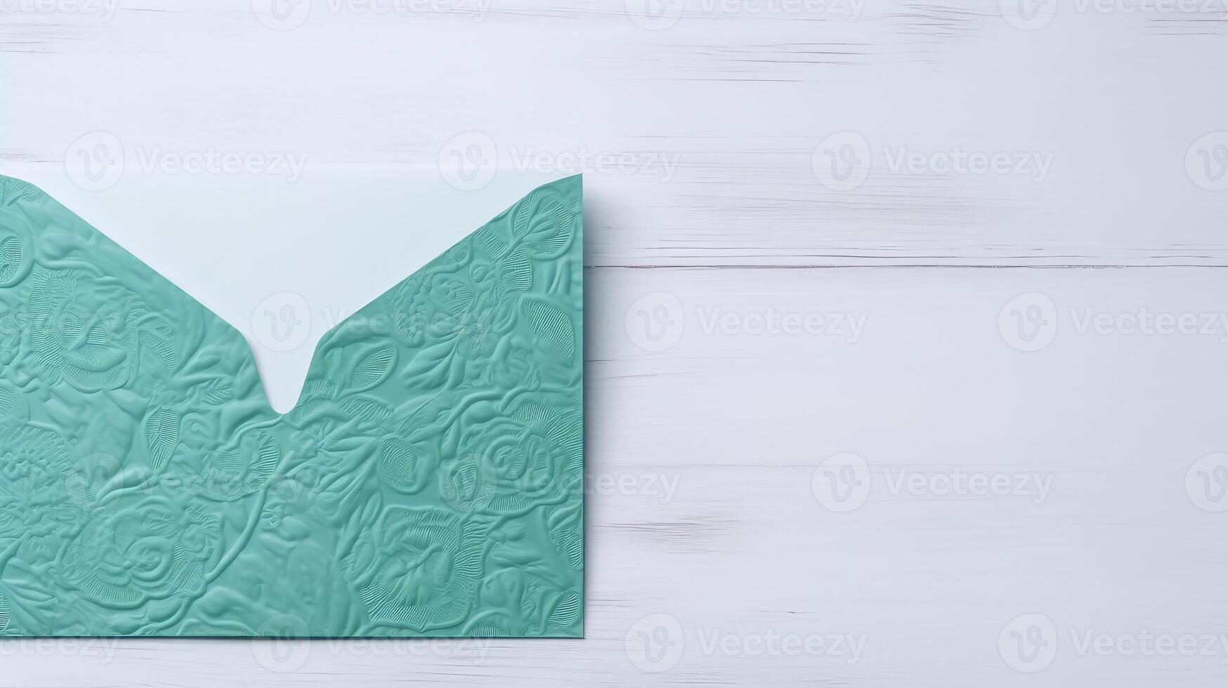 Isolated Customized Green Floral Embossed Luxury Wedding or Event Card, Envelope on White Wooden Background and Space for Message. . photo