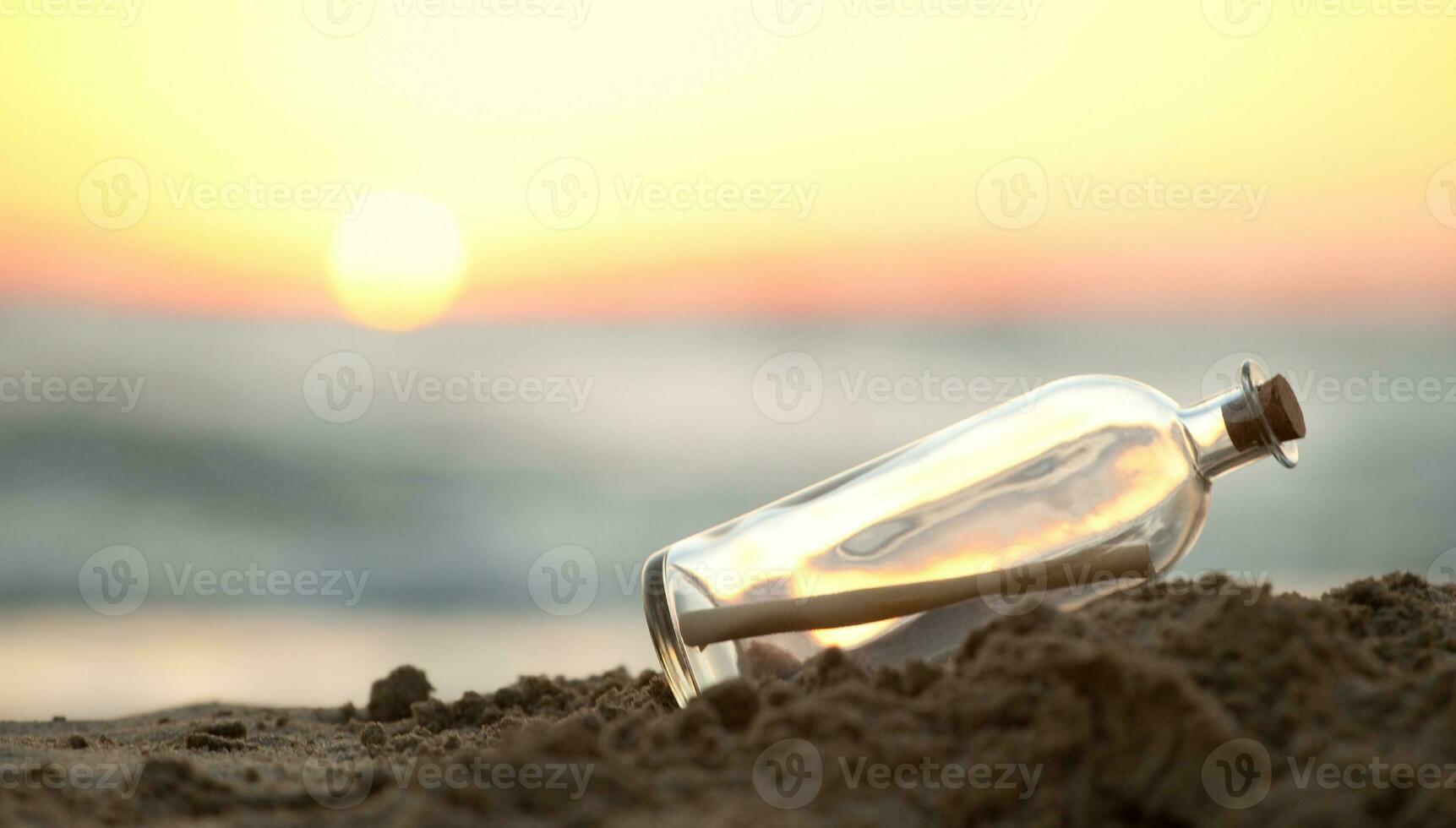 Message in a Bottle on sea beach photo