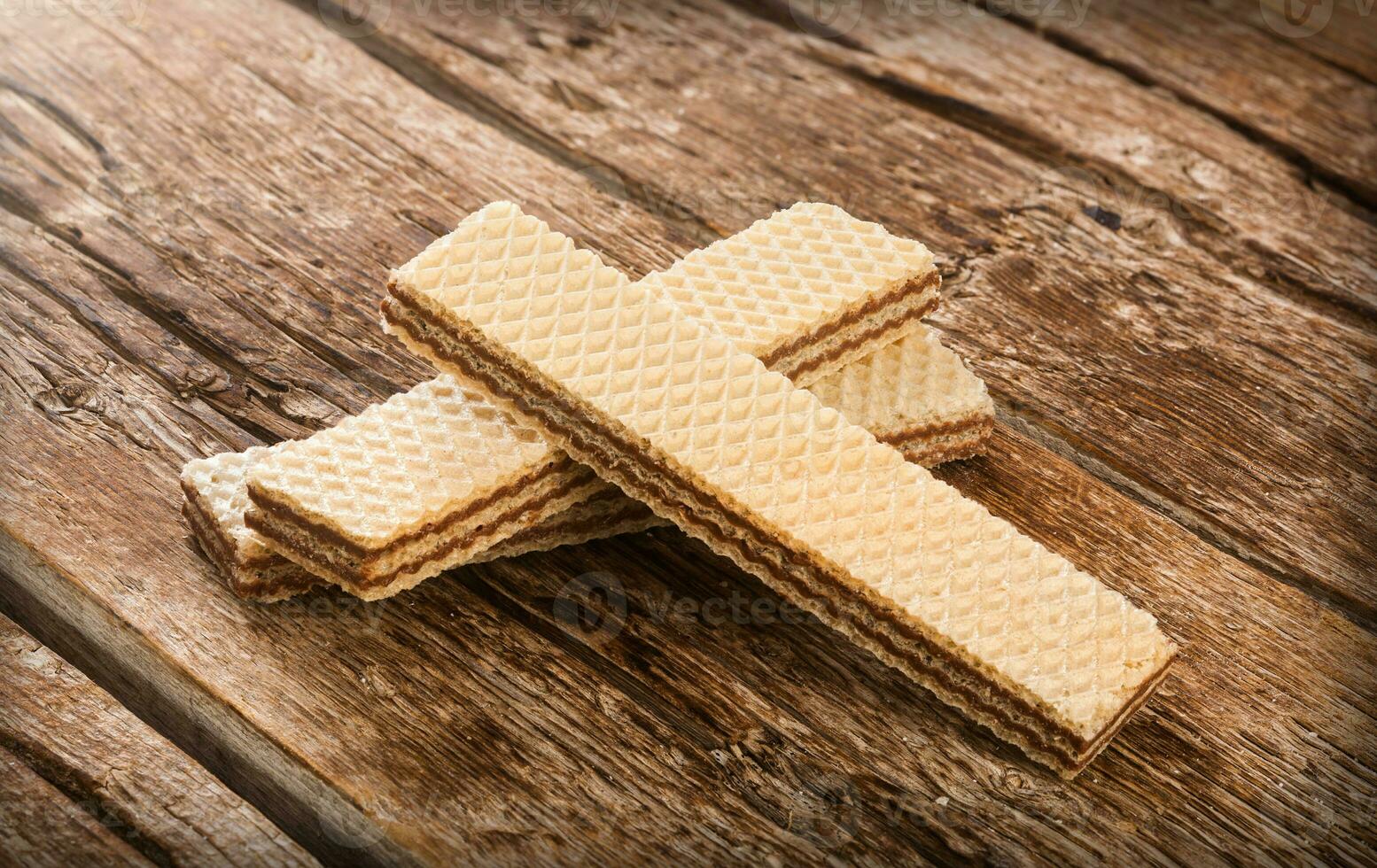 Wafers on wooden table. photo