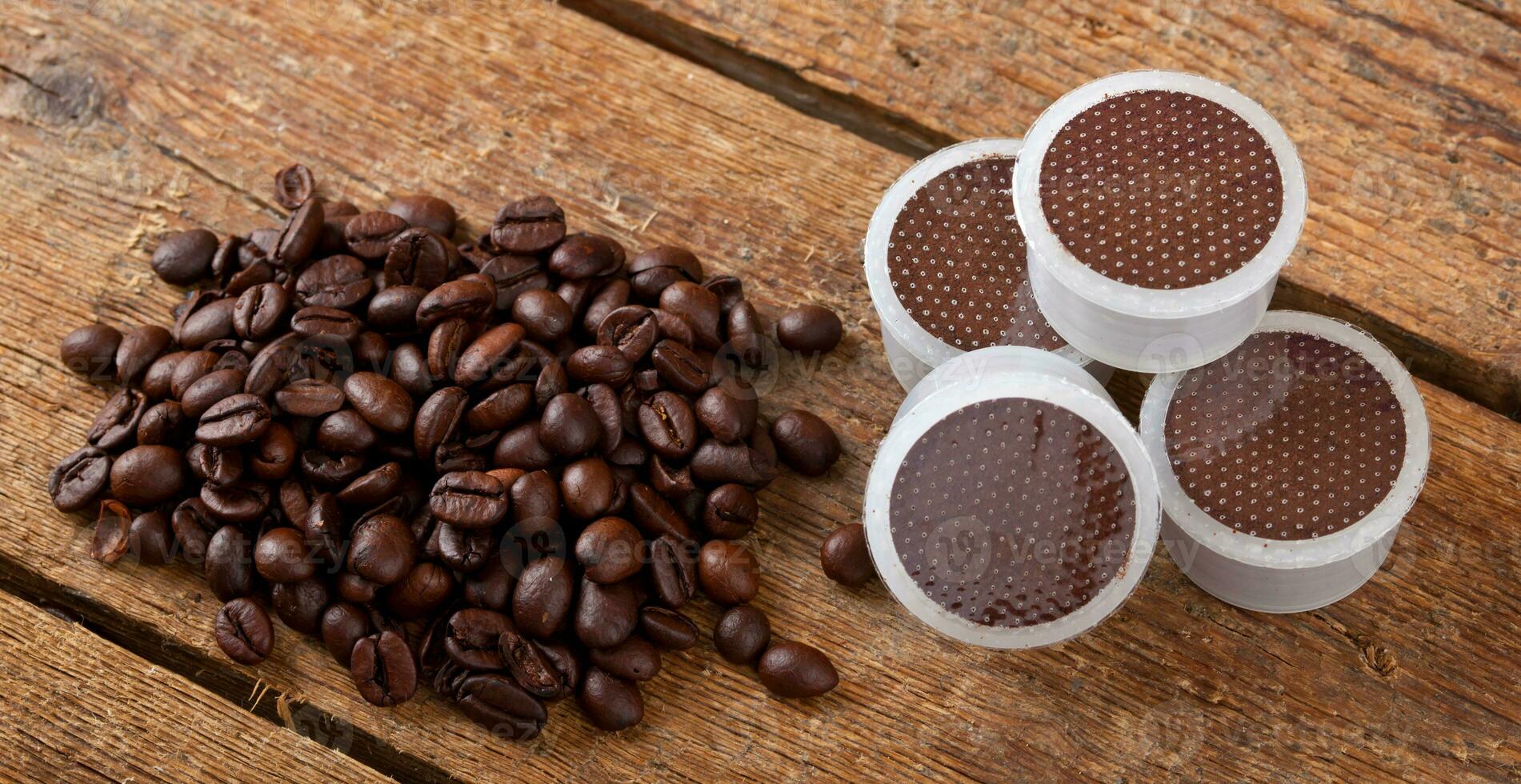 Coffee pods on wooden table photo