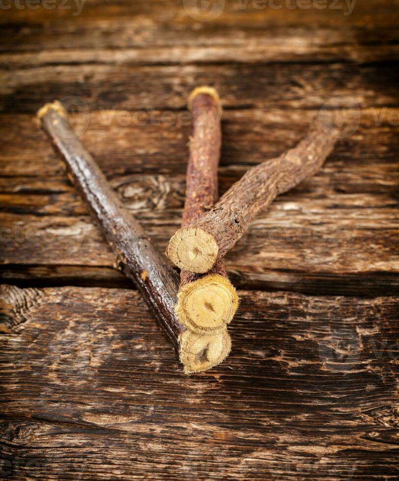 Licorice roots on rustic table. photo