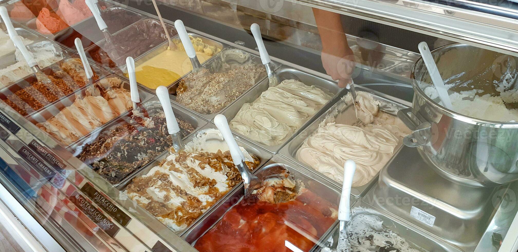 Different flavors of ice cream in a ice cream shop photo