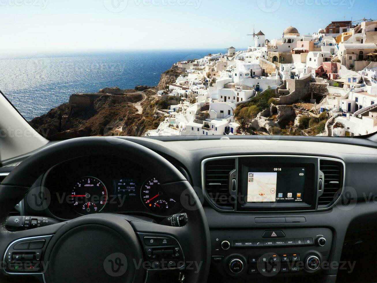 Car dashboard traveling to Santorini Island photo