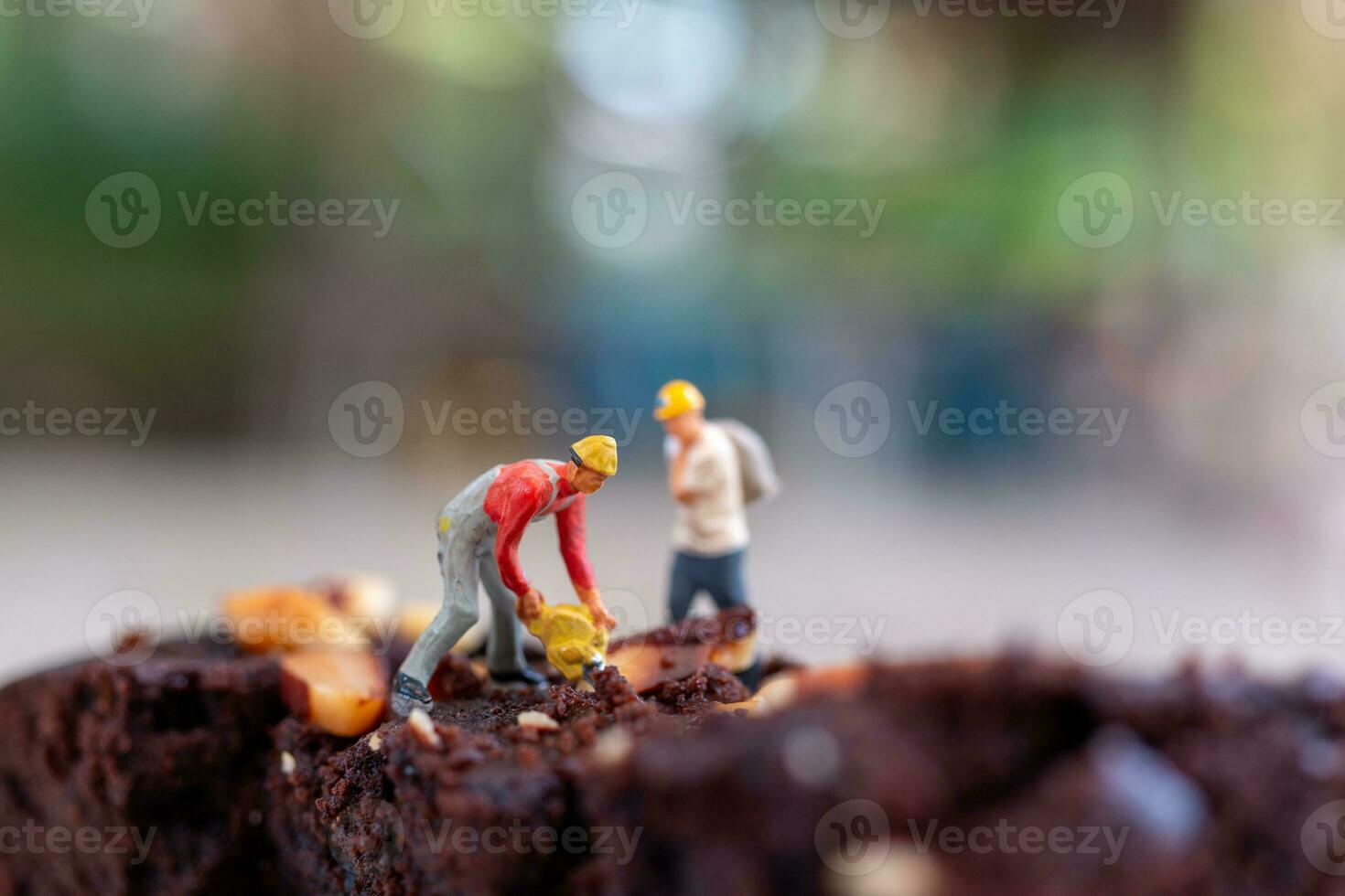 Miniature people, An employee is making a chocolate brownie photo