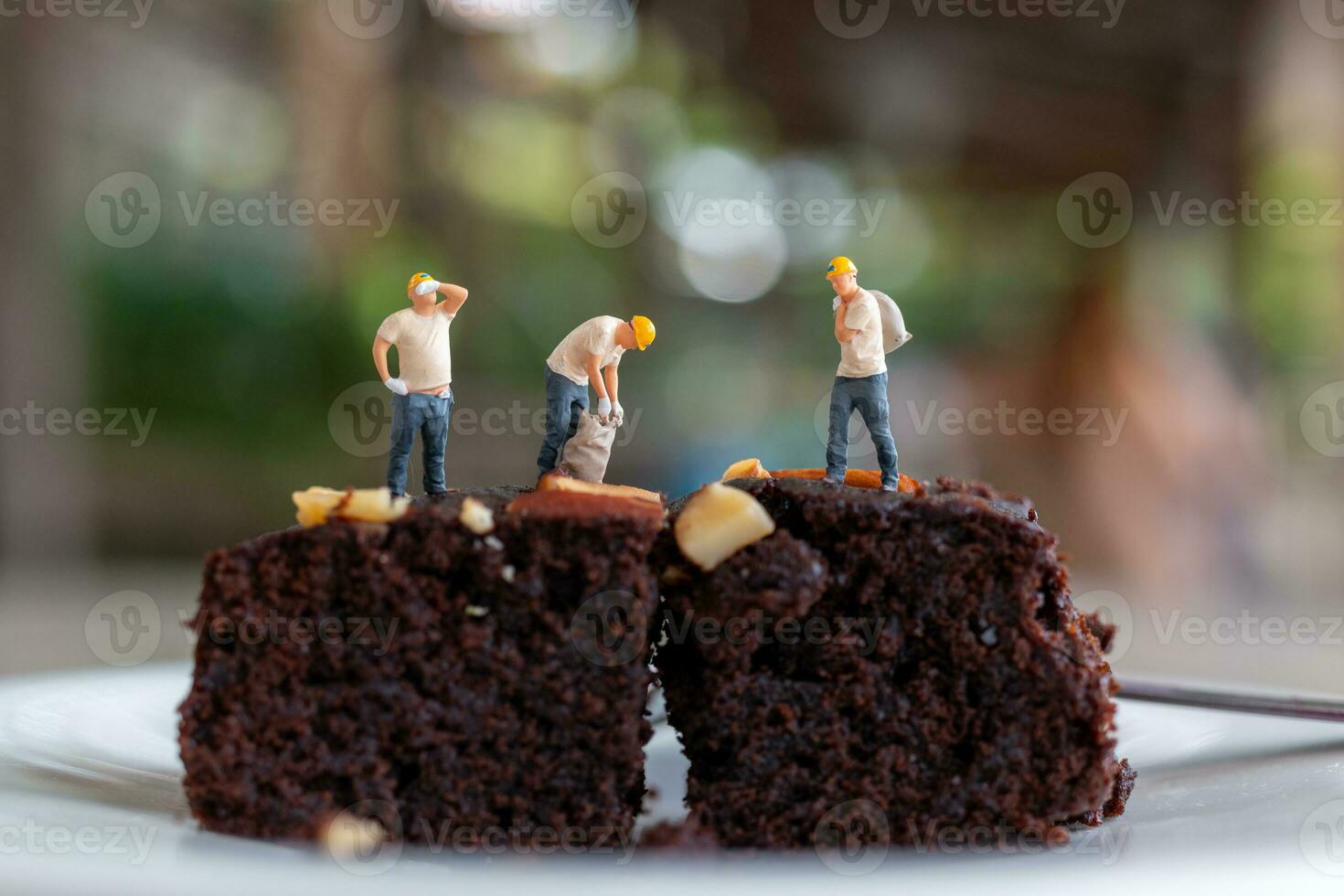Miniature people, An employee is making a chocolate brownie photo