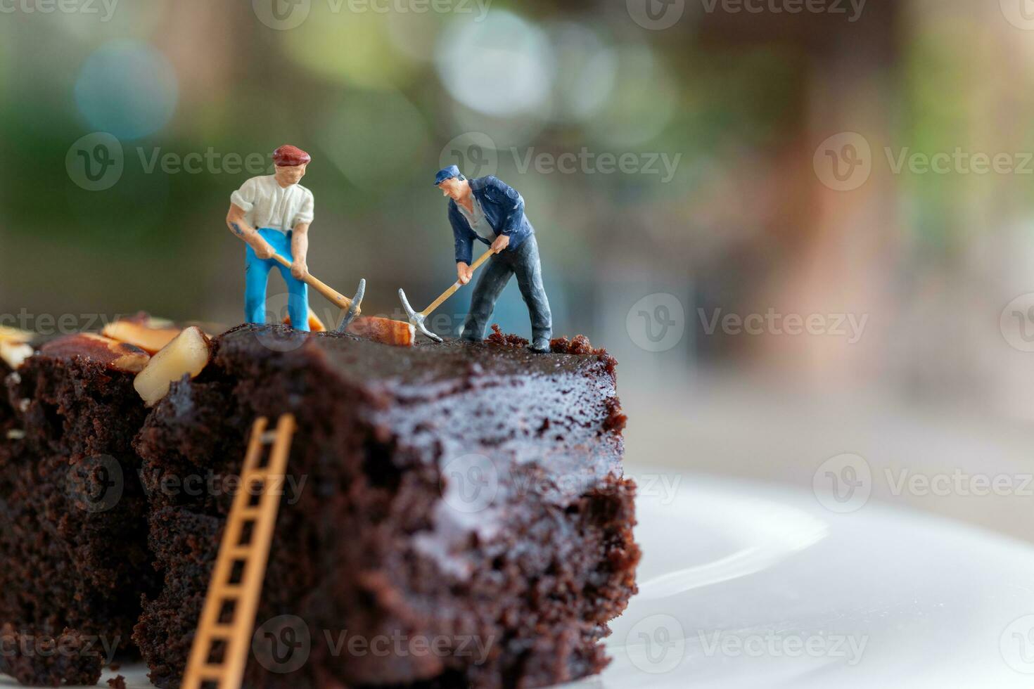 Miniature people, An employee is making a chocolate brownie photo