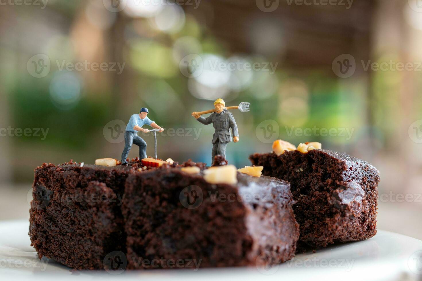 Miniature people, An employee is making a chocolate brownie photo