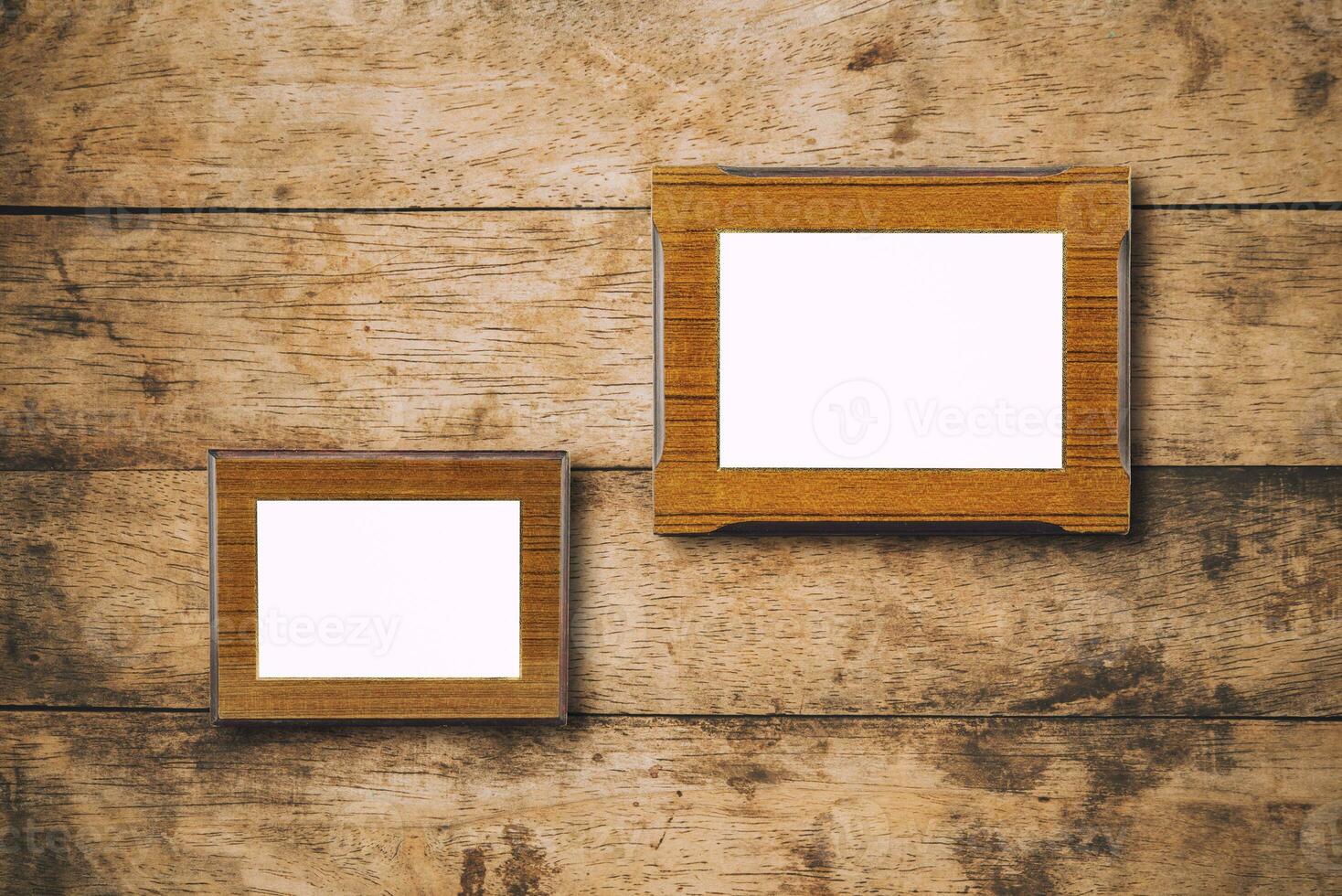 Blank photo wood frame on old brick wall