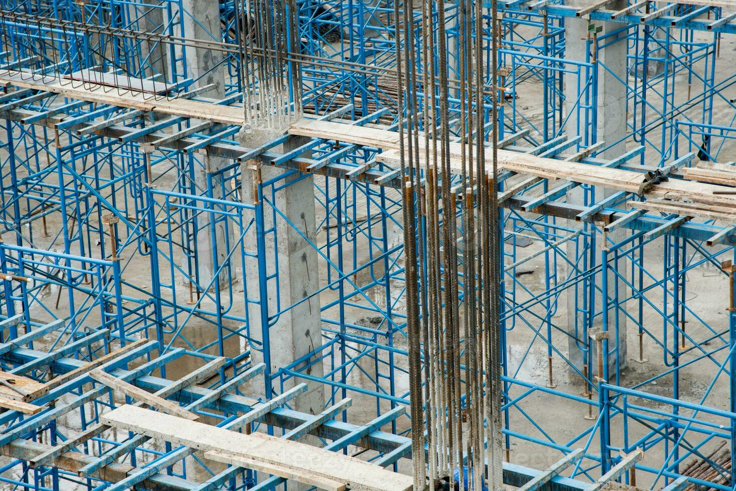 Construction site, workers on scaffolding. photo