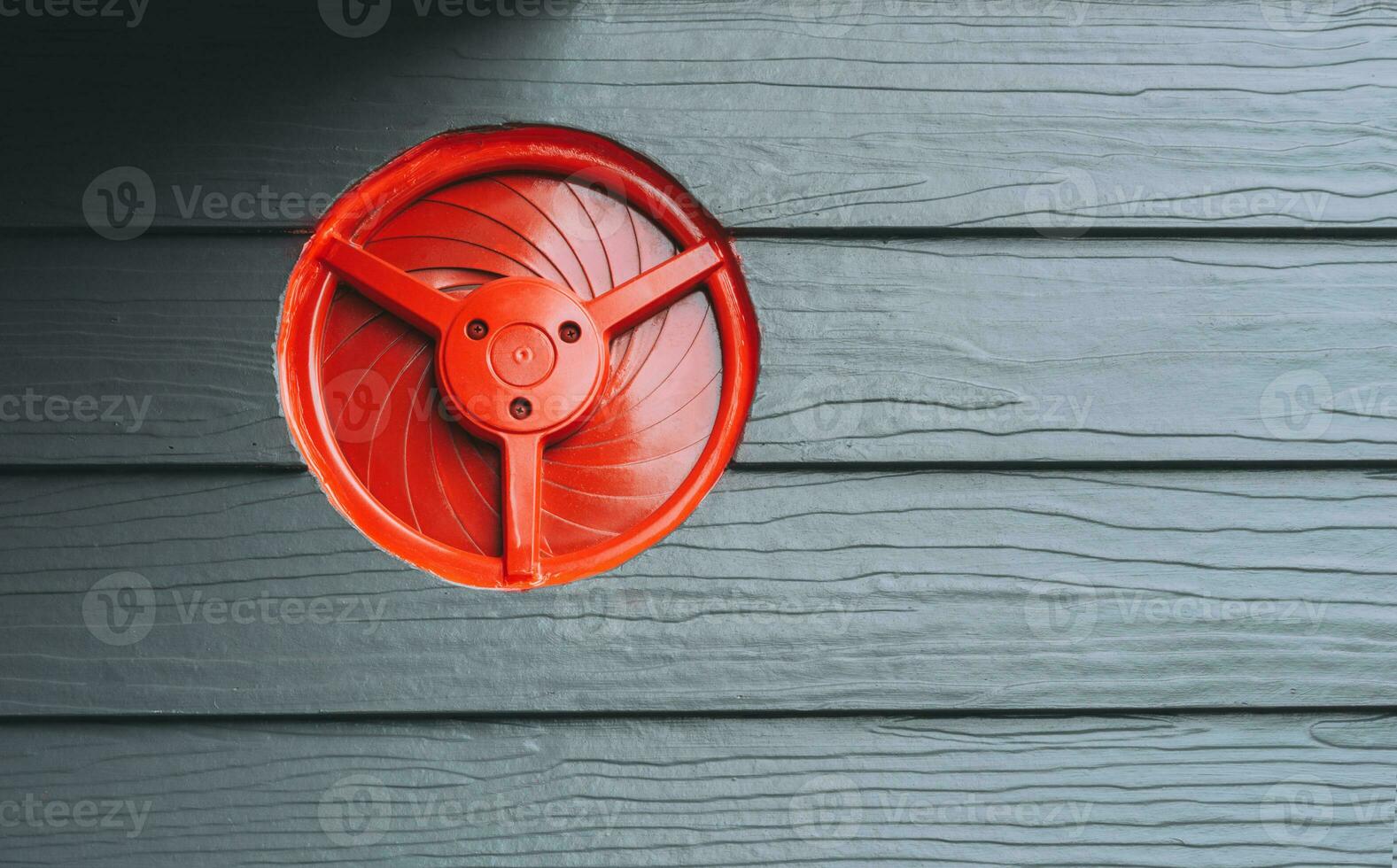 Ventilation system and circle vent window on a wooden wall photo