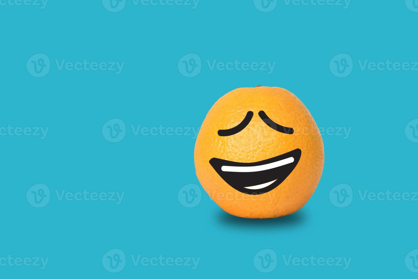 Orange face funny on blue background. Clipping path photo