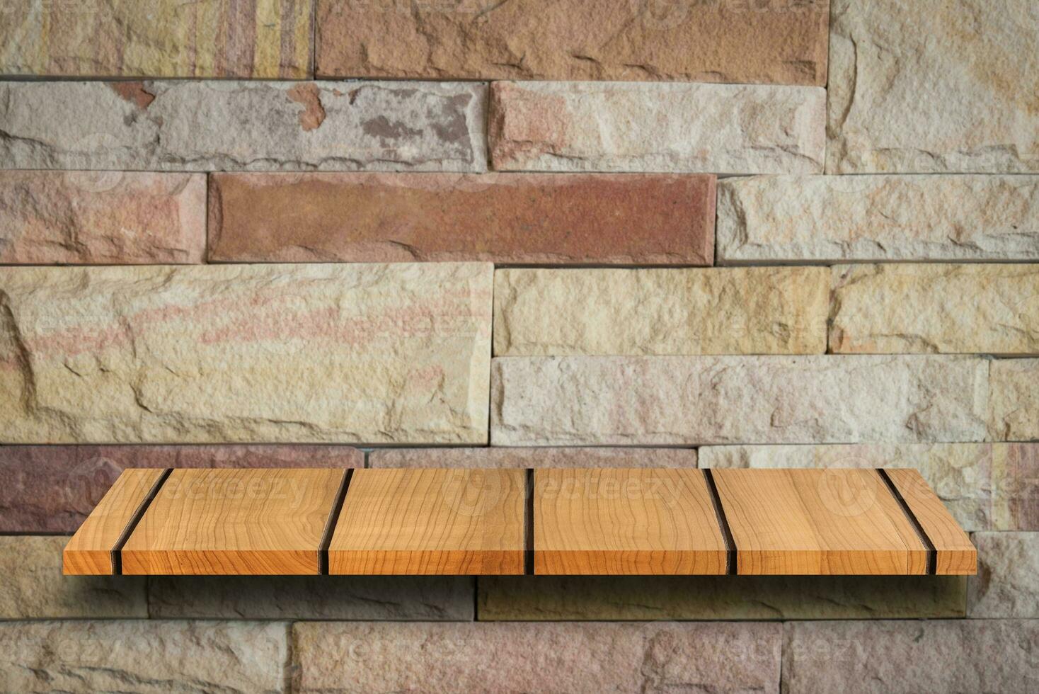 Empty top wooden shelves and stone wall background. For product display photo