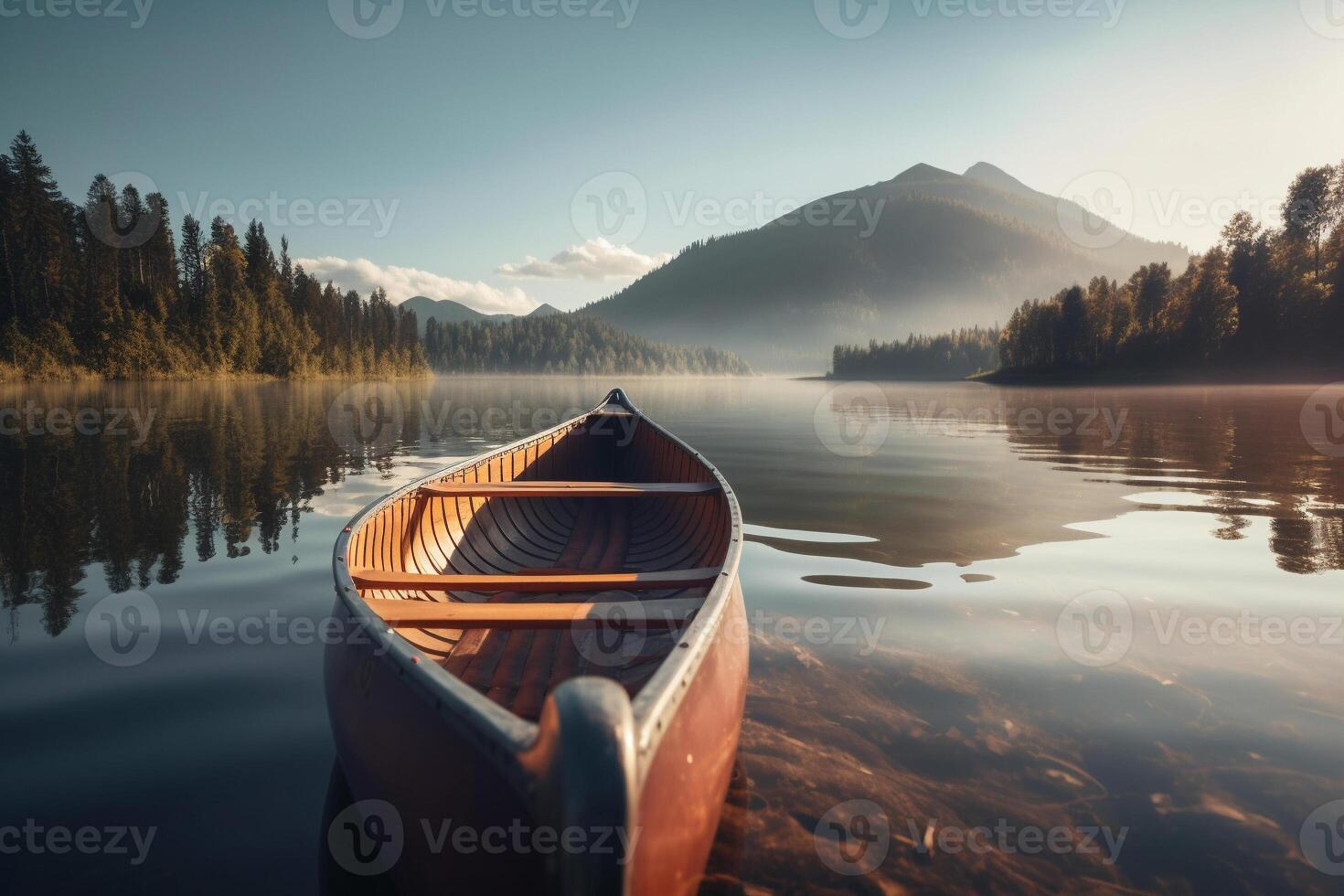 Canoe floating on a serene mountain lake surrounded by tall pine trees on a peaceful morning. photo