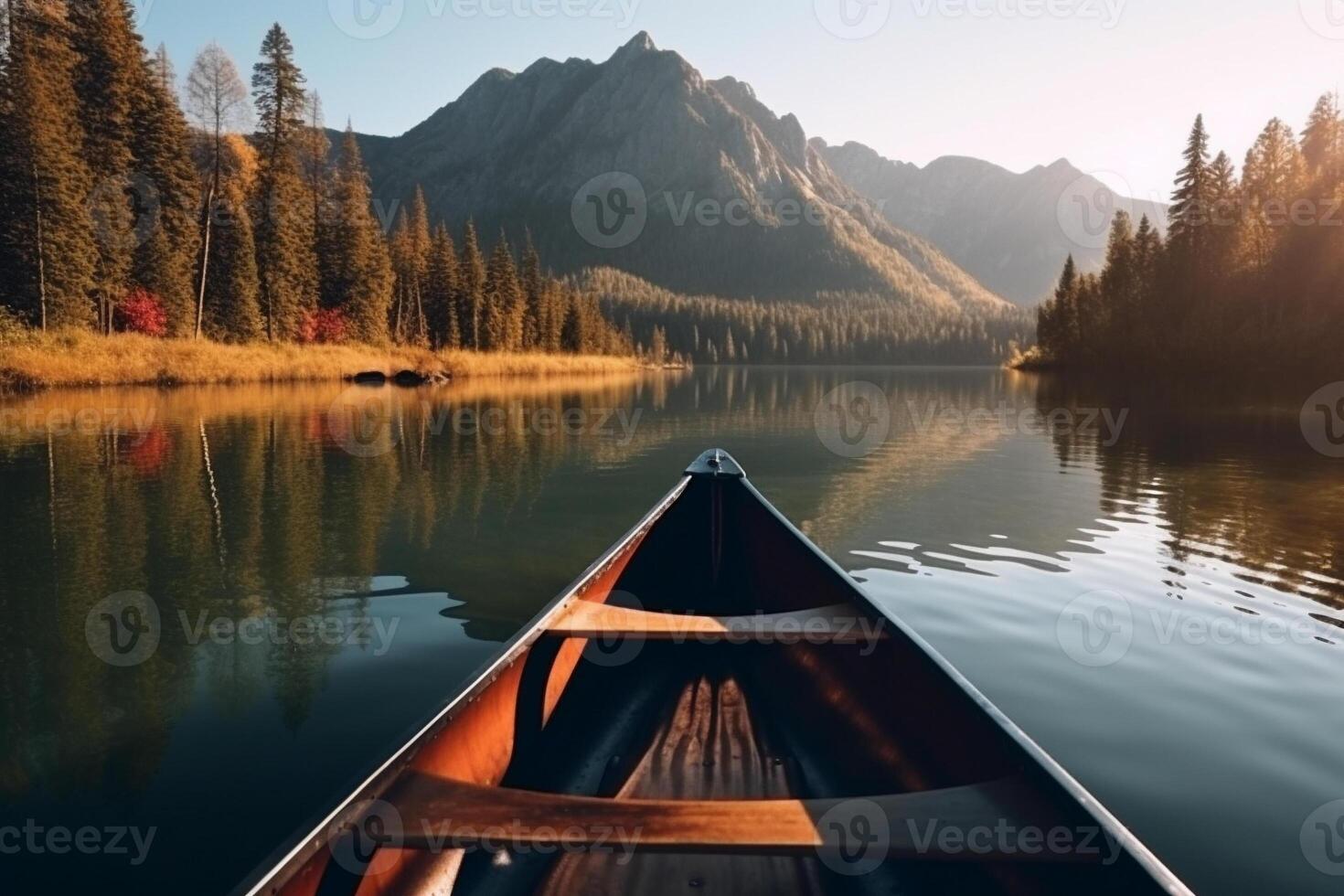 Canoe floating on a serene mountain lake surrounded by tall pine trees on a peaceful morning. photo