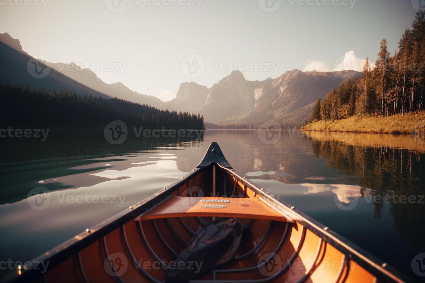 Canoe floating on a serene mountain lake surrounded by tall pine trees on a peaceful morning. photo