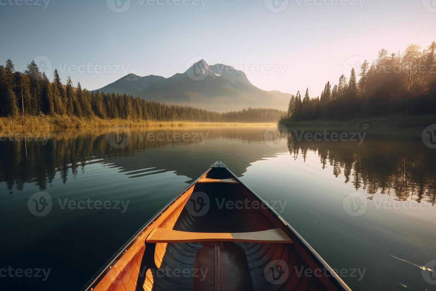 Canoe floating on a serene mountain lake surrounded by tall pine trees on a peaceful morning. photo