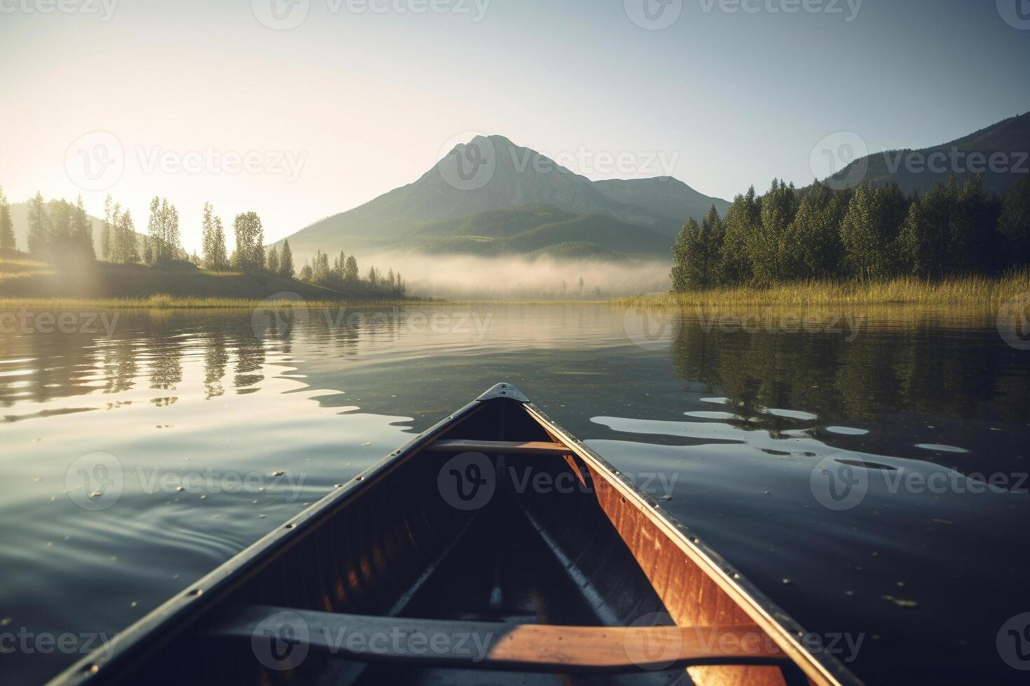 Canoe floating on a serene mountain lake surrounded by tall pine trees on a peaceful morning. photo