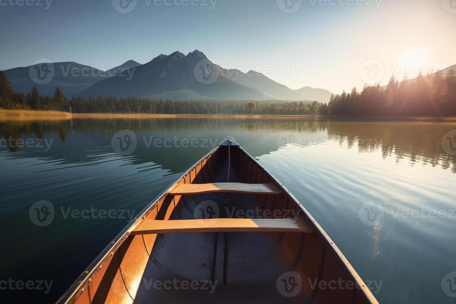 Canoe floating on a serene mountain lake surrounded by tall pine trees on a peaceful morning. photo