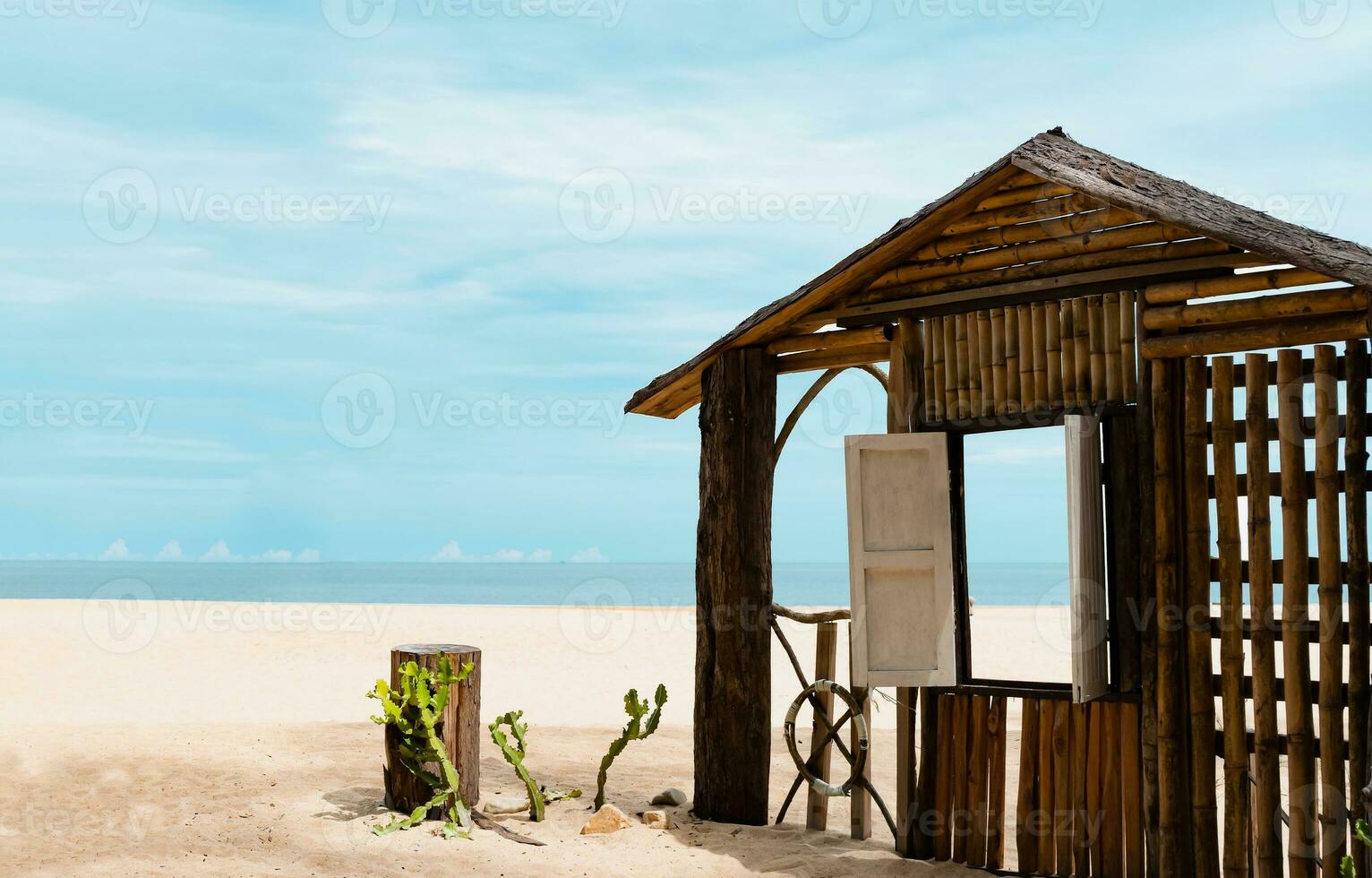 Wooden window frame by the sea in sunny day Summer,Beach hut on sandy beach with window open through ocean sea view,Seaside view point for Summer Holiday promotion or Product presentation background photo