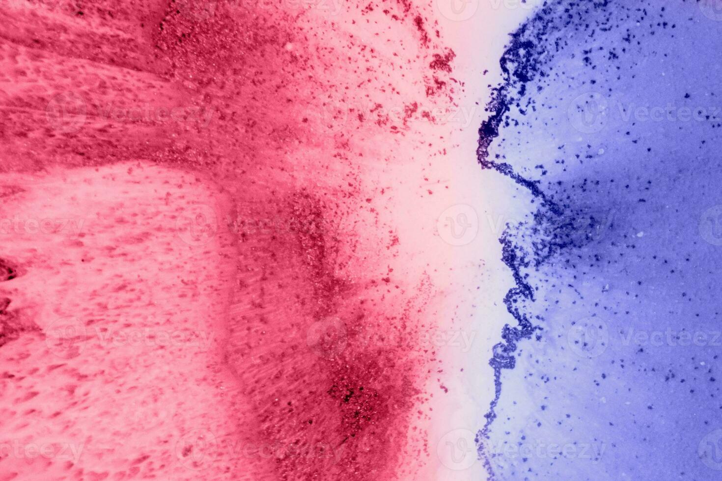Spread-out acrylic paint. Abstract background, made in the technique of fluid art. Changing colors of the year concept. Very Peri and Viva Magenta. photo